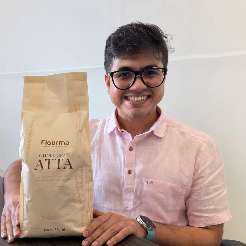 Ankur holding a pack of Flourma Multigrain Protein